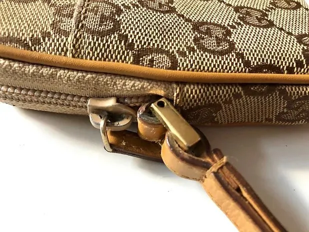 GUCCI MONOGRAM WALLET POUCH